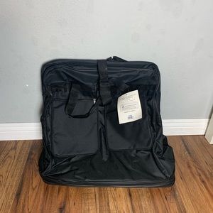 NEW - Durable Black Rolling Travel Duffle Bag - 6 Wheels